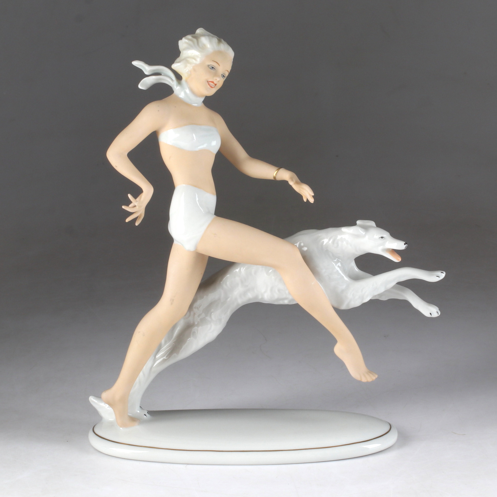 FIGURIN, kvinna med hund, porslin, Schaubachkunst, 1900-tal.