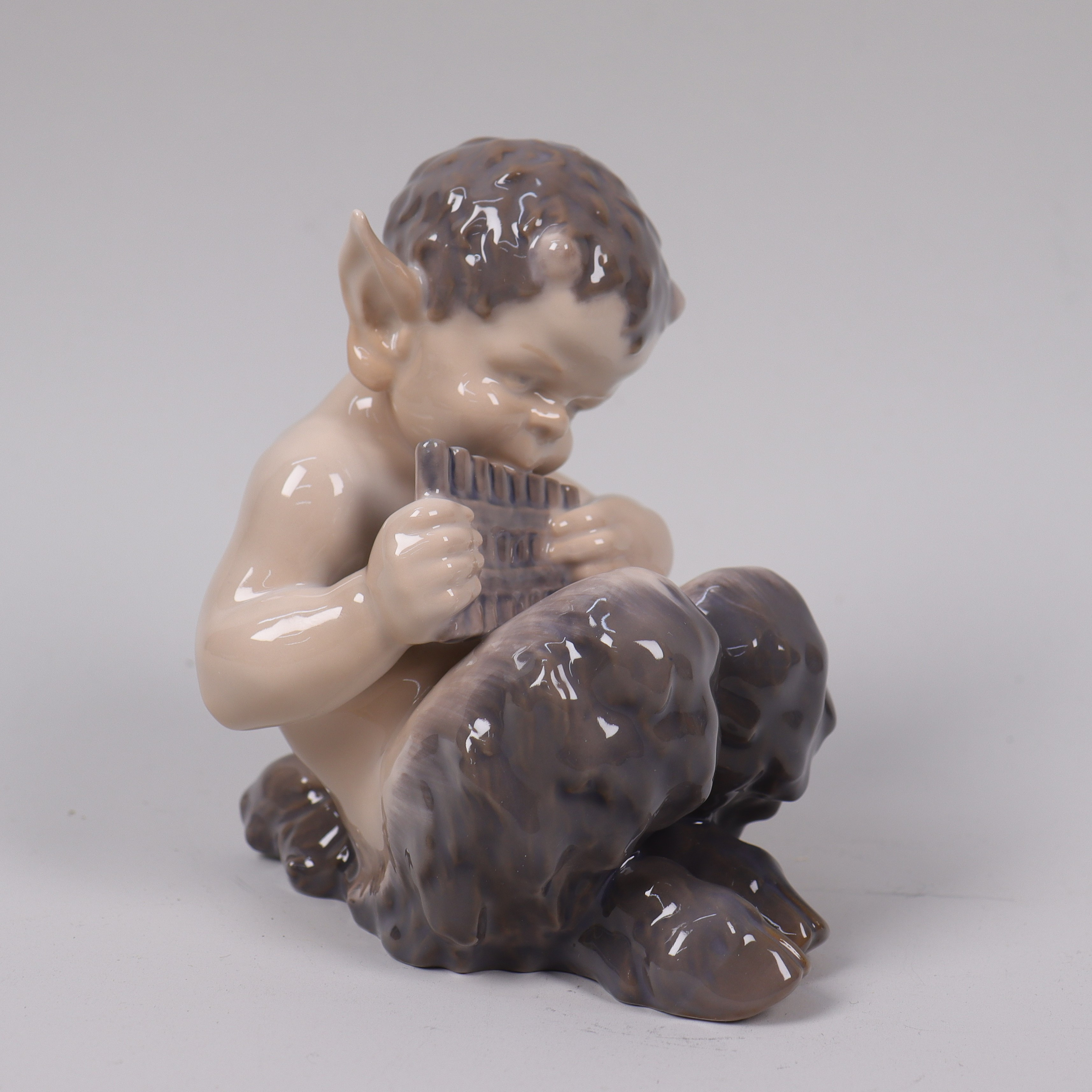 CHRISTIAN THOMSEN. för Royal Copenhagen, figurin #1736, faun med panflöjt.