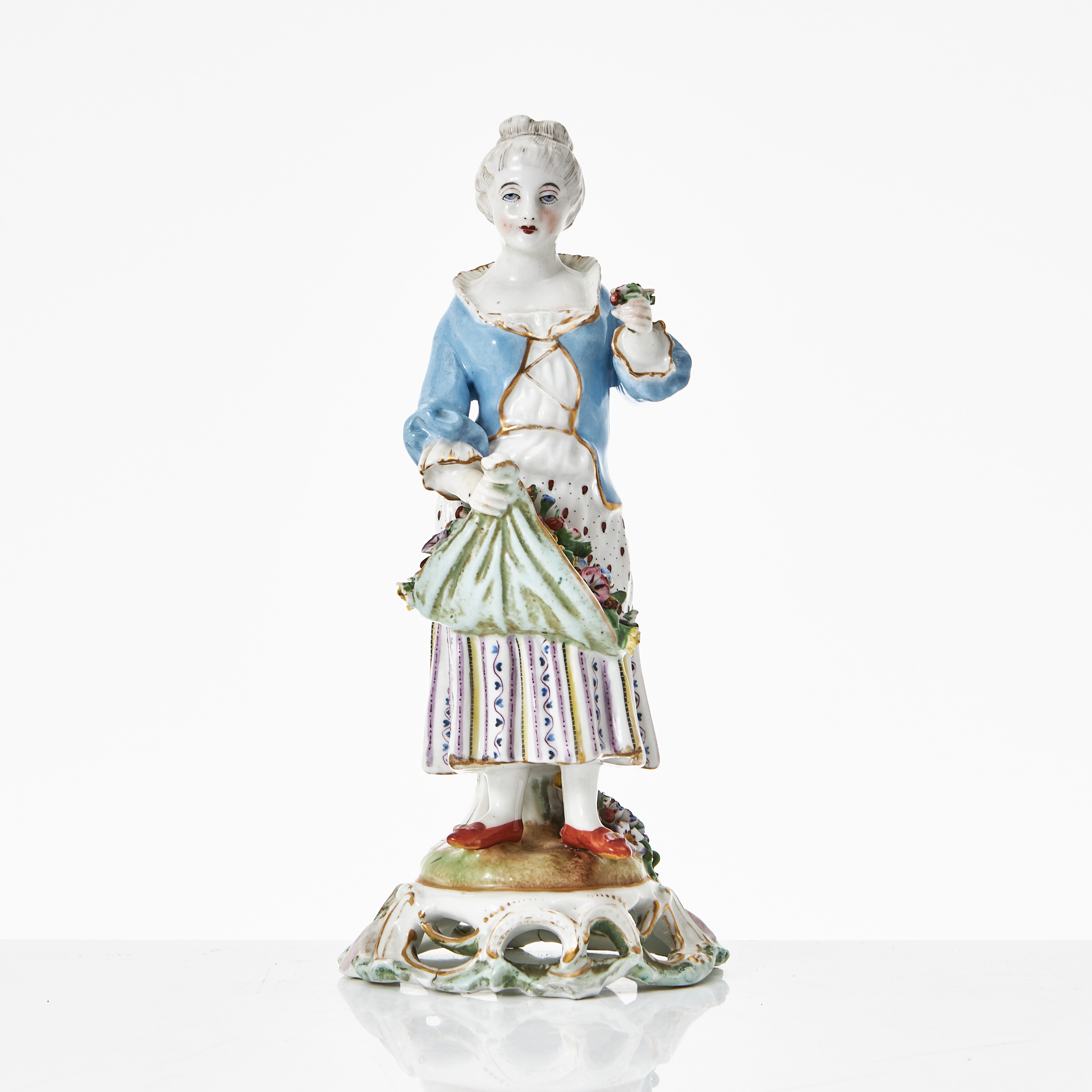 FIGURIN, porslin, 1800-tal, i form av blomsterflicka, Meissenliknande märke, polykromt bemålad, detaljer i guld.