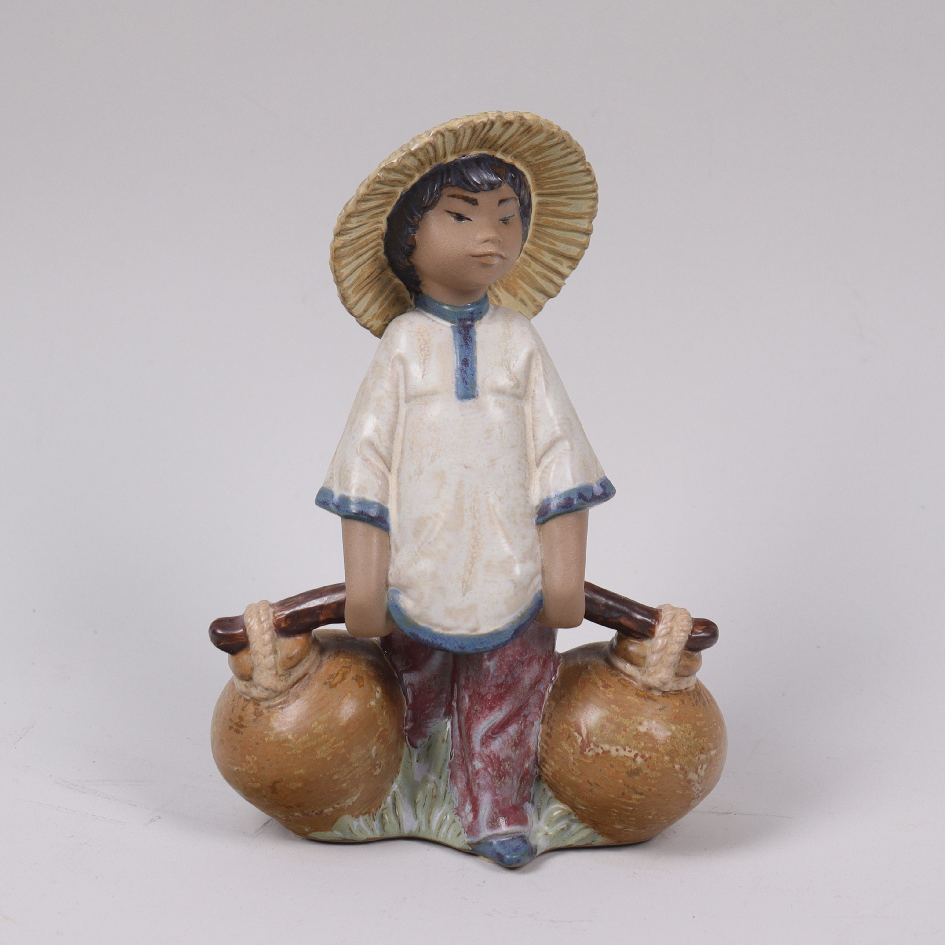 JOSÉ PUCHE. för Lladro, "Chinese Boy", figurin i keramik.