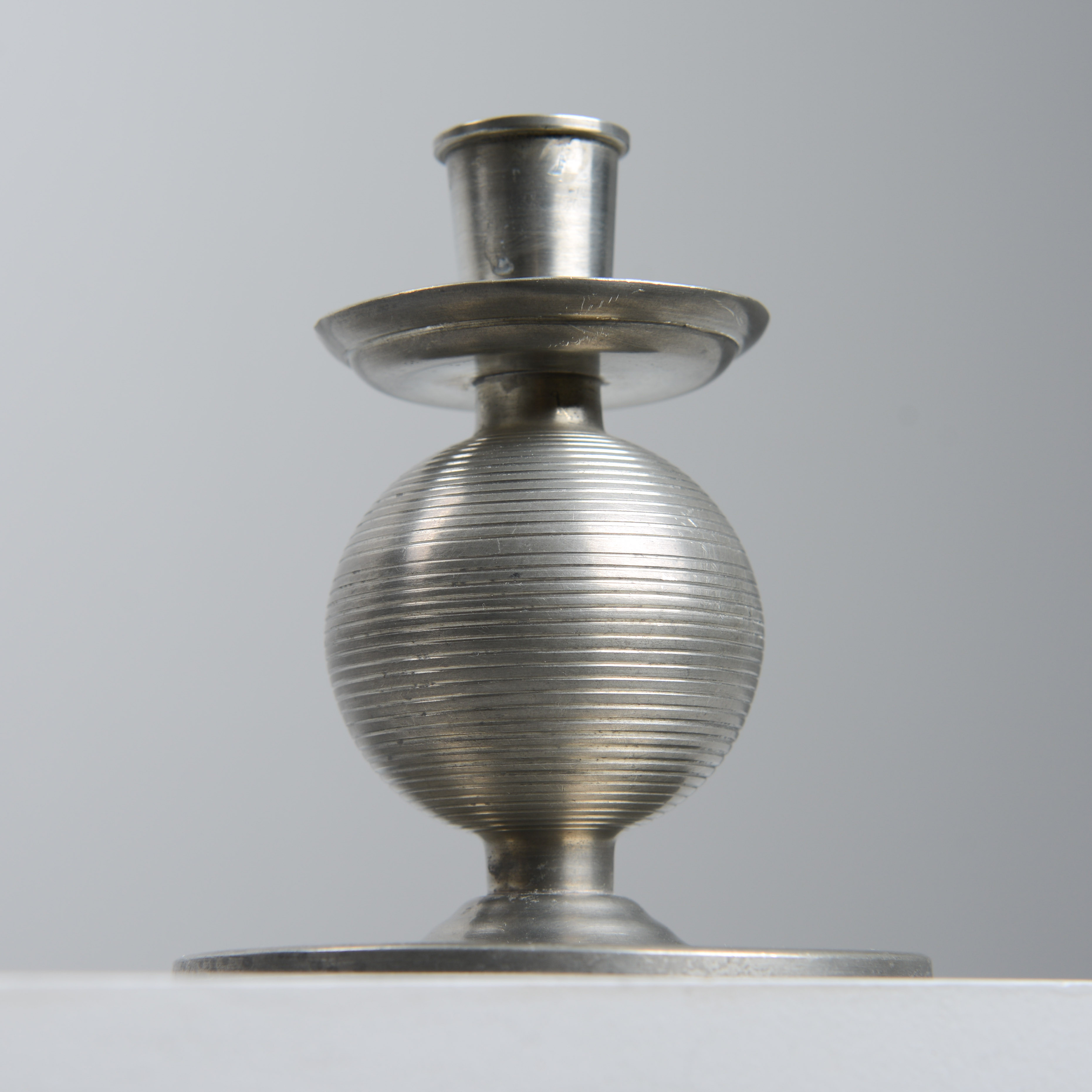 NILS  FOUGSTEDT. Ljusstake, tenn, Fabriksaktiebolaget Kronsilver, 1935.