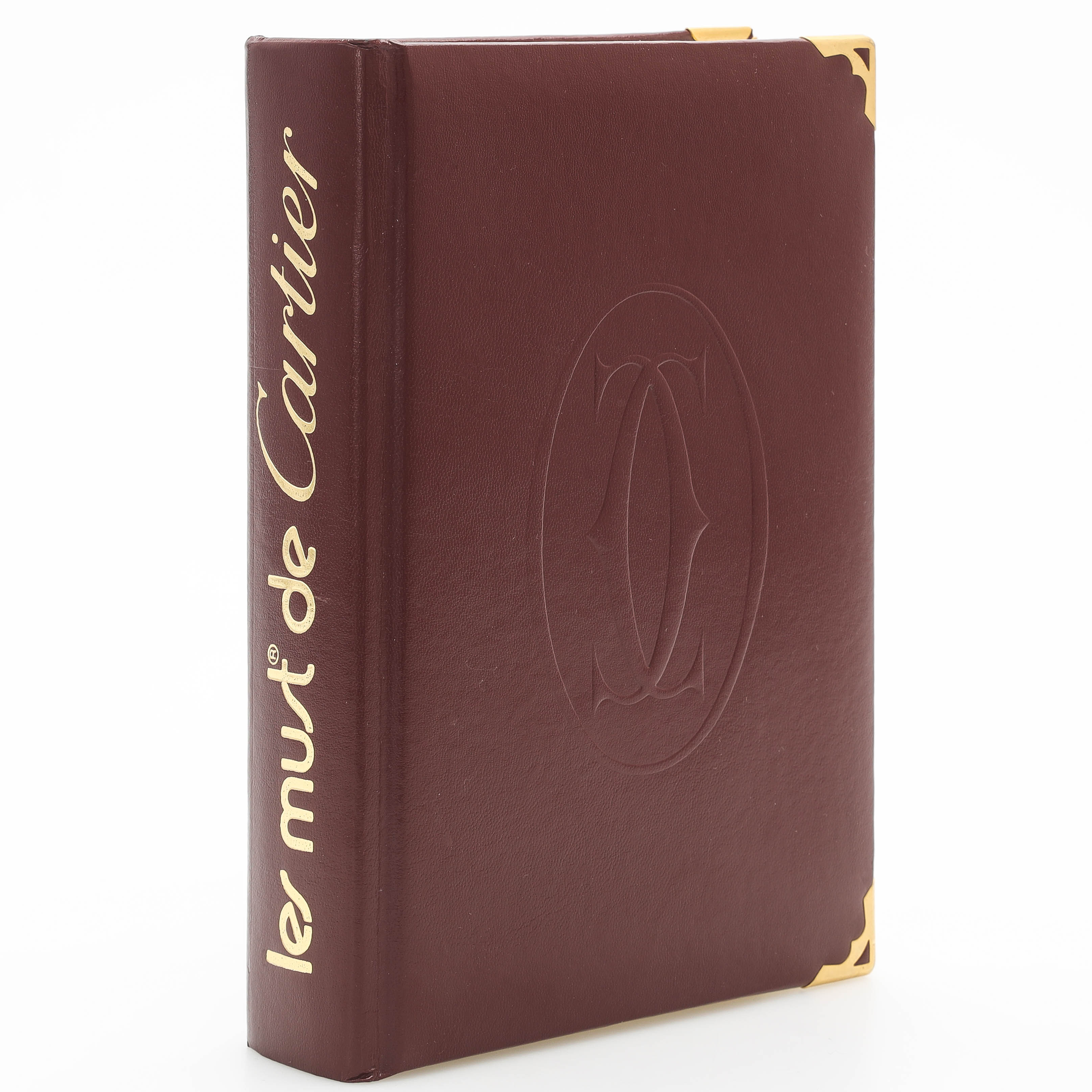 CARTIER. inbunden bok, författare Anne-Marie Clais, "Les Must de Cartier", utgiven 2002.