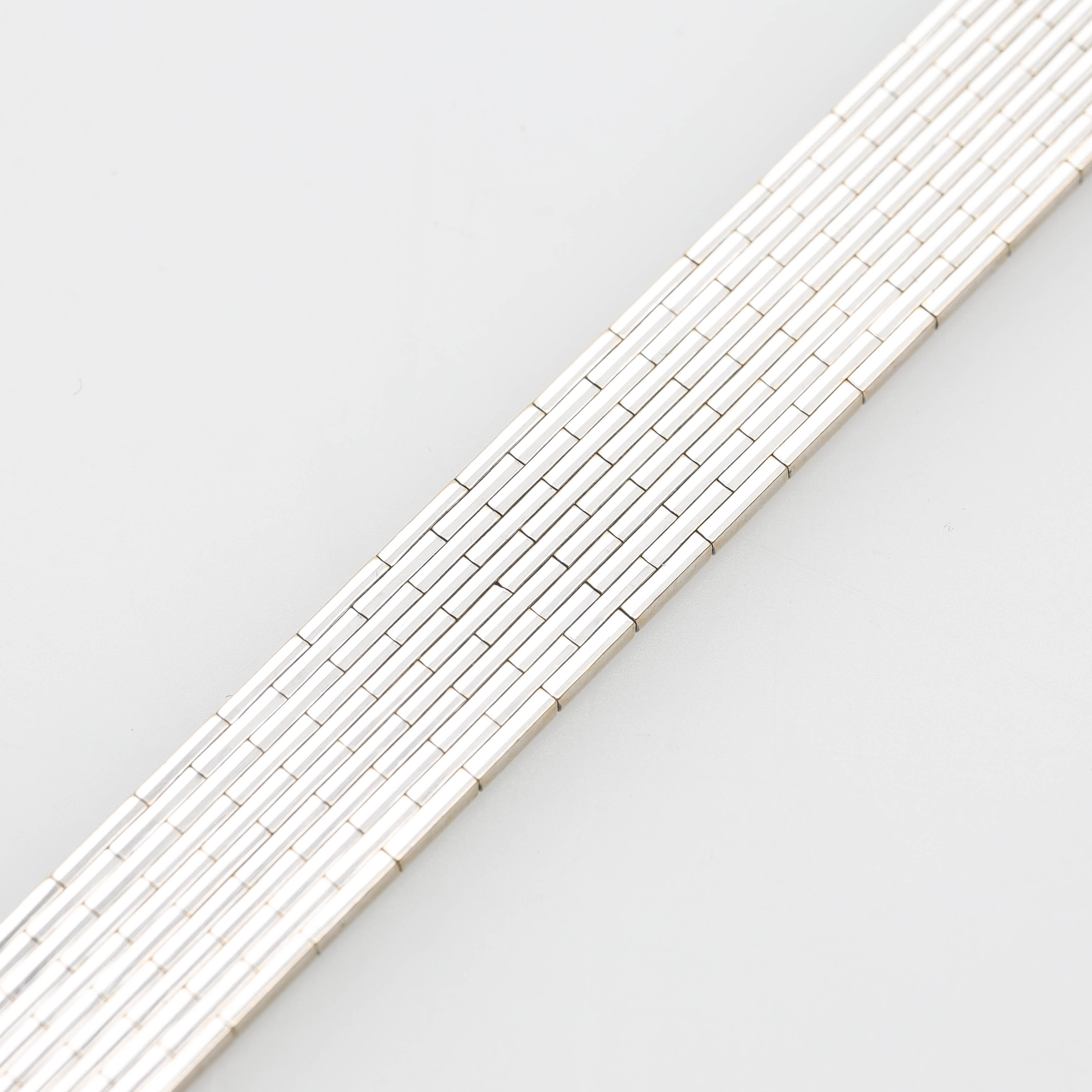 ARMBAND, 18 k vitguld, rodierat, mönstrad korridorlänk.