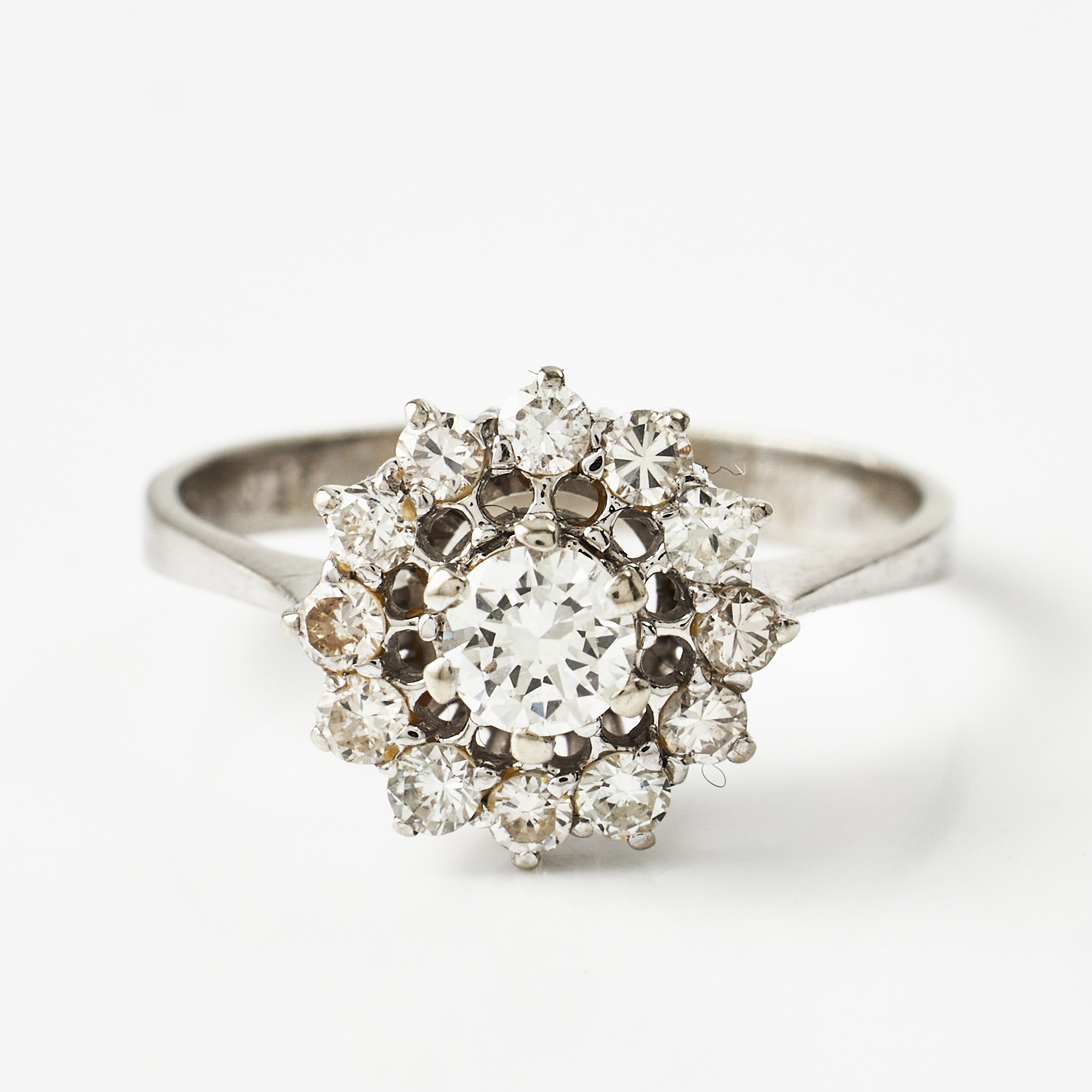 RING, 18 k vitguld, carmosémodell, 13 briljanter totalt ca 0,75 ct., svensk kontrollstämpel.