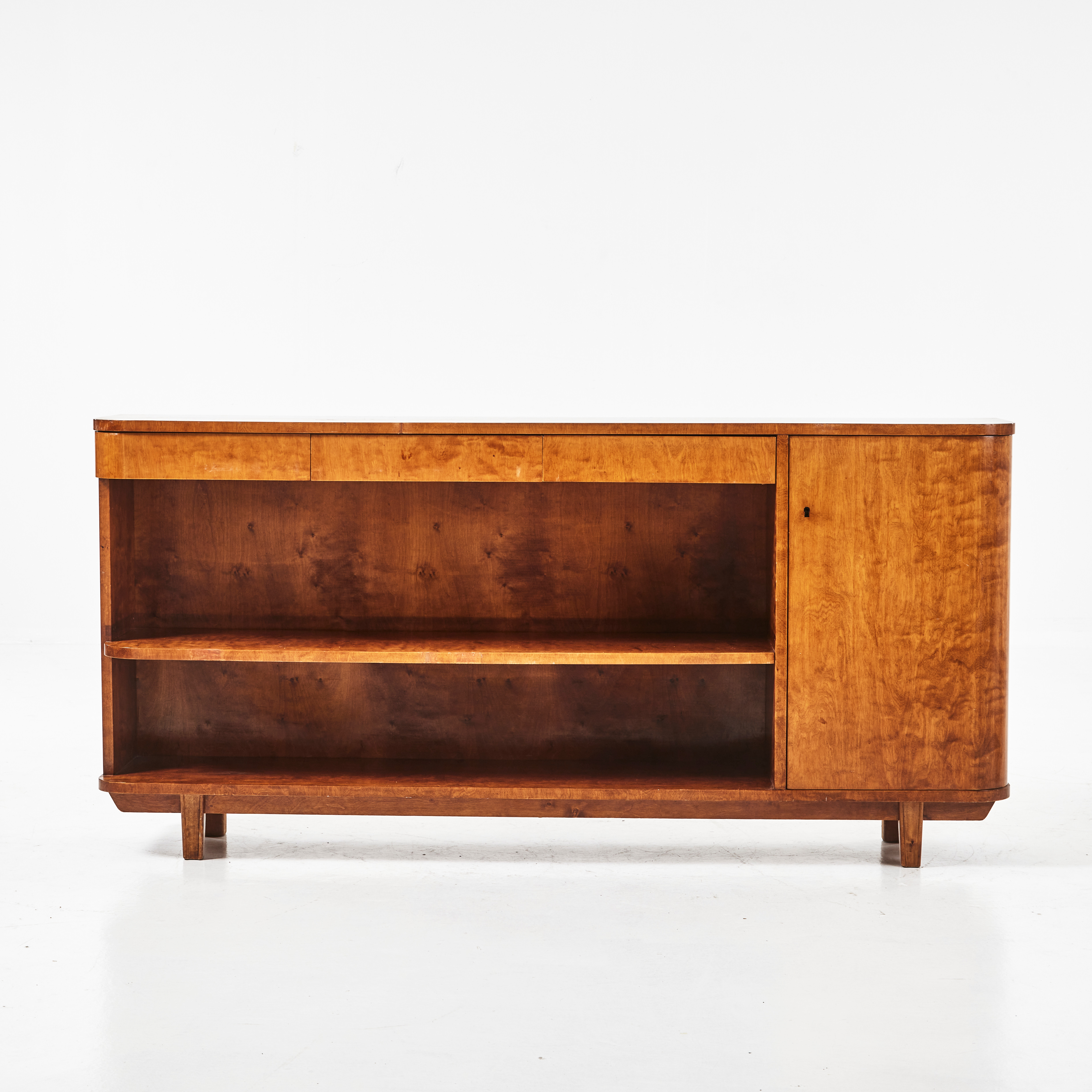 BOKHYLLA, fanerad i björk, 1930-tal, funkis, 3 lådor, skåpsdel, svängda hörn.