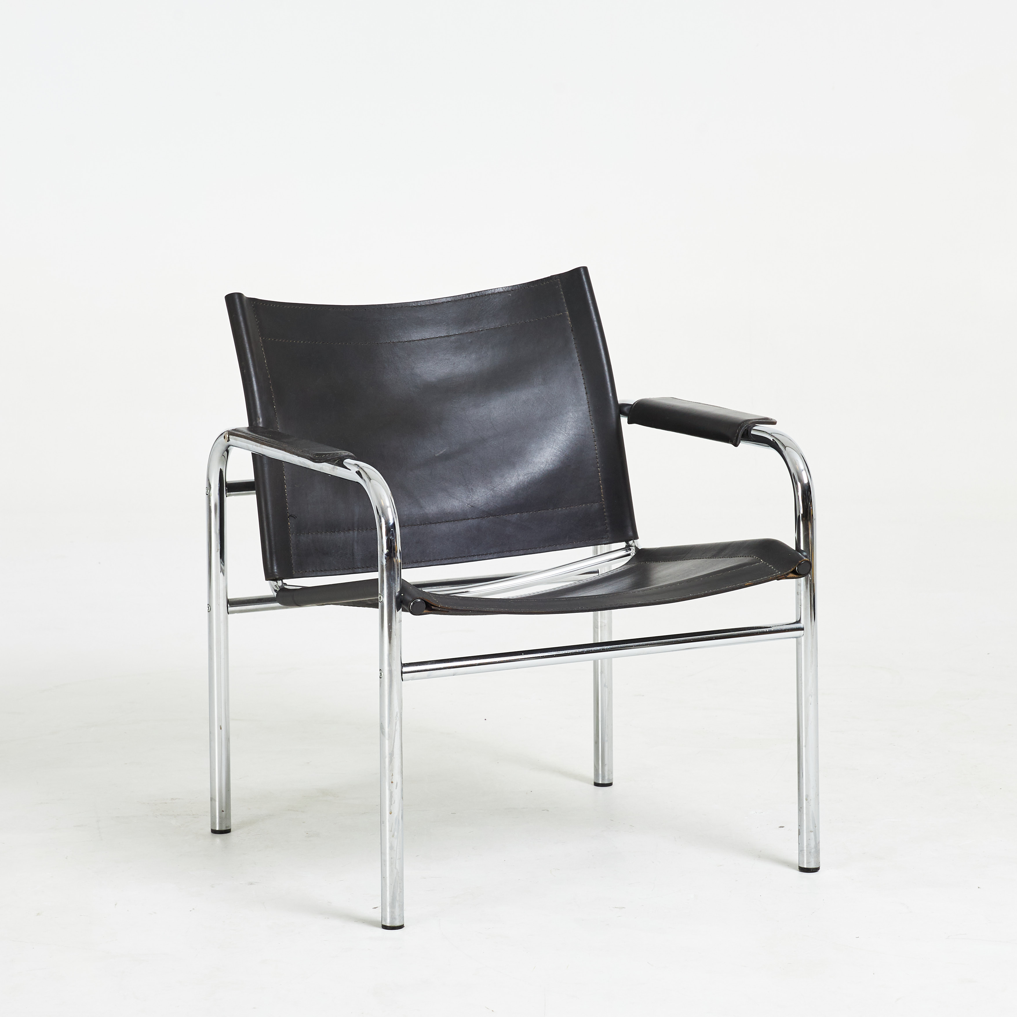 TORD BJÖRKLUND. Fåtölj, "Klinte", IKEA, sits och rygg i läder, kromad stomme.
