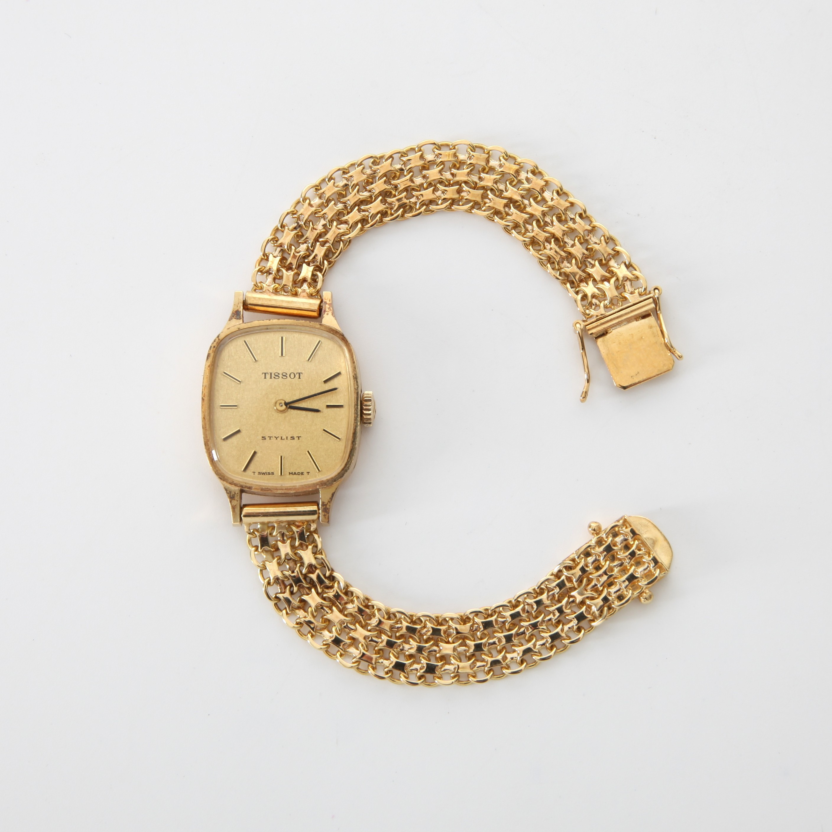 ARMBANDSUR TISSOT Stylist, 18K guld, manuell, med 3-radig x-länk, 1970-tal.