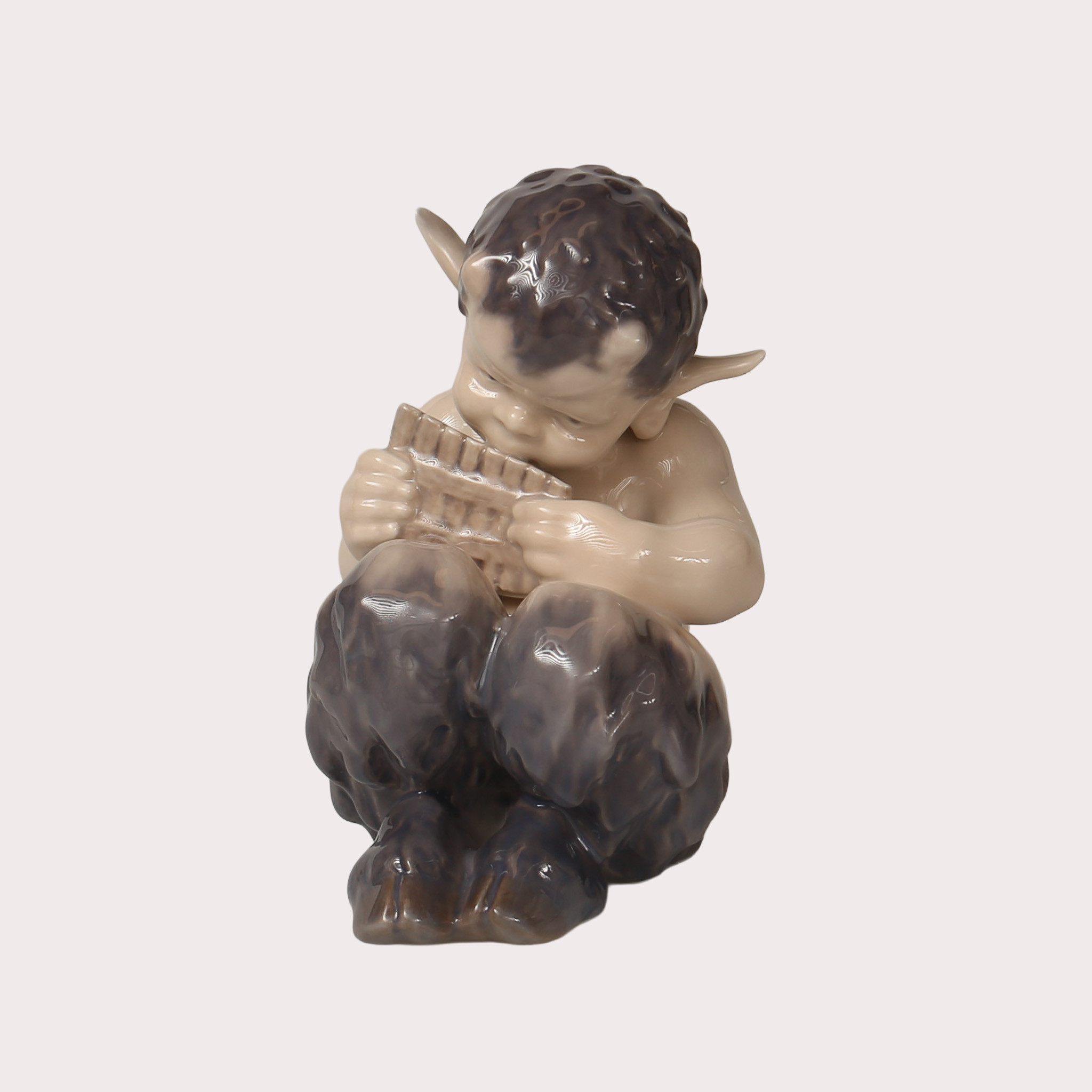 CHRISTIAN THOMSEN. Faun med panflöjt, modell 1736 Royal Copenhagen, Danmark.