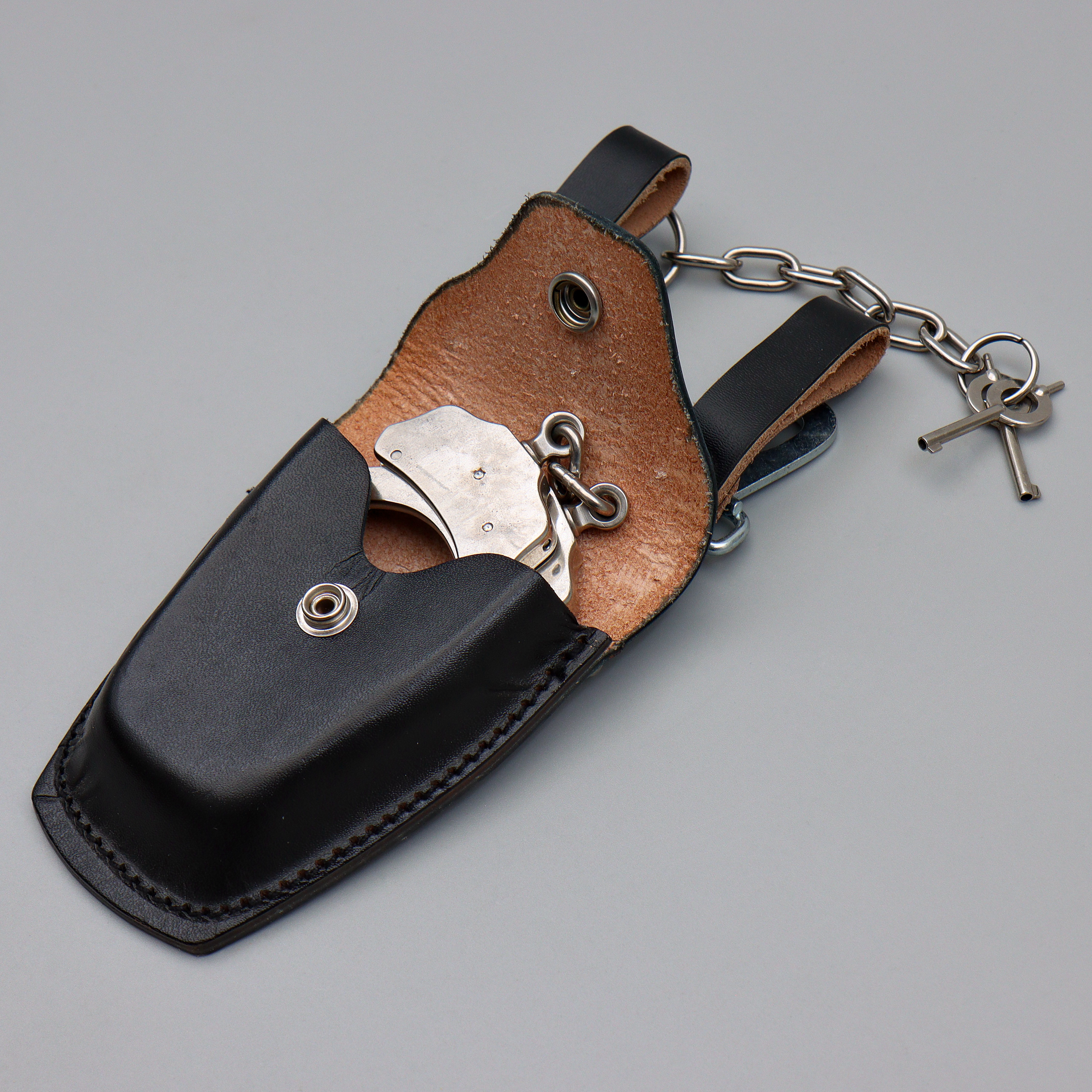 HANDKLOVAR, THE PEERLESS HANDCUFF CO. SPRINGFIELD MASSACHUSETTS PATENT 1531451-1872857, MADE IN USA.
