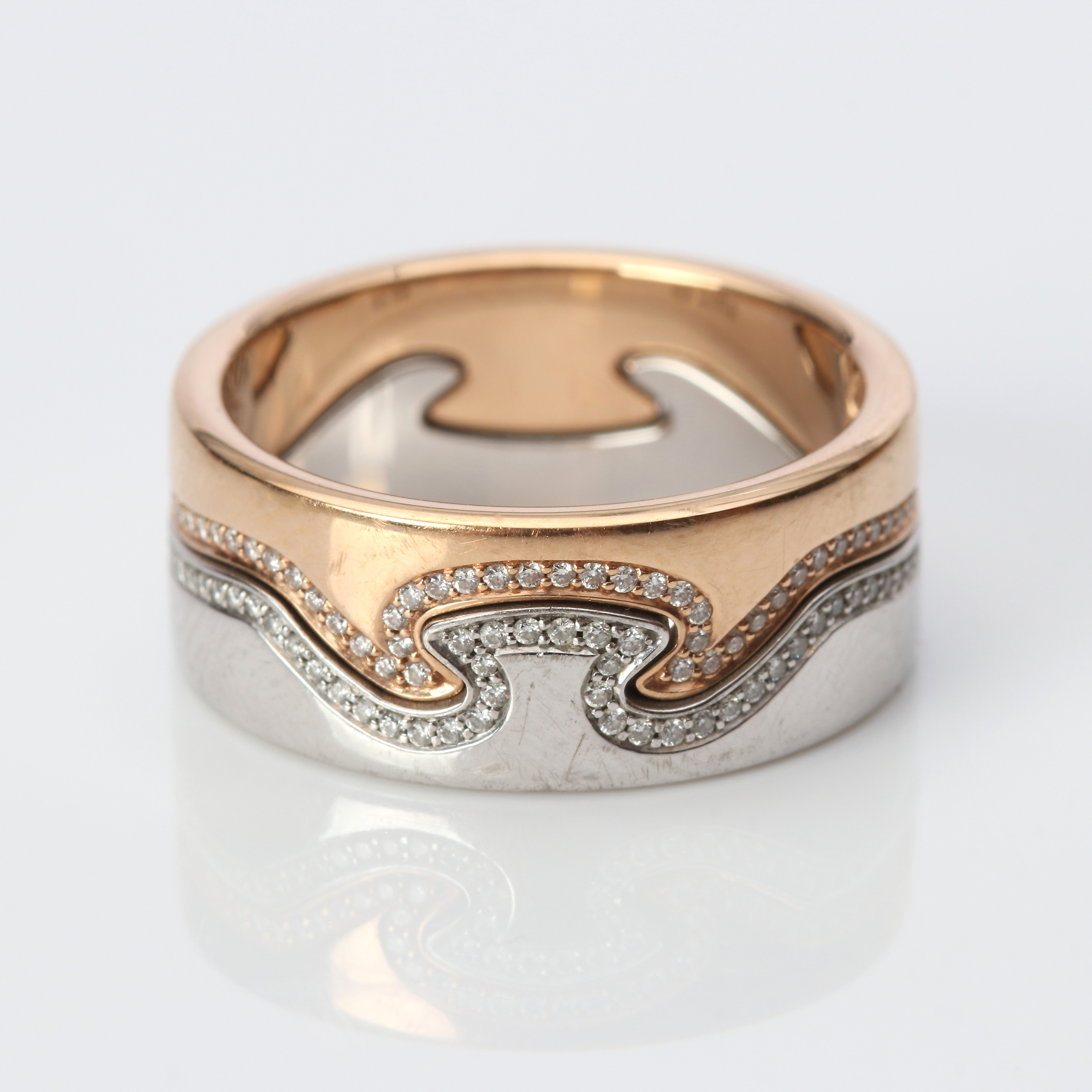 NINA KOPPEL, RING "FUSION", TVÅ DELAR. 18k röd- och vitguld med små diamanter, Georg Jensen, totalvikt ca 11,3 gram.