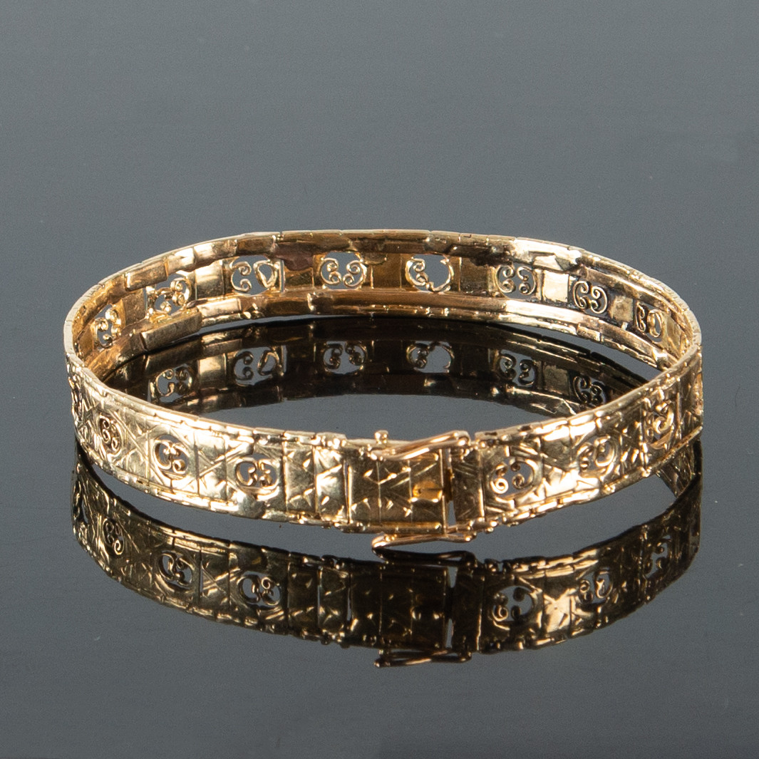 ARMBAND i 18K guld med genombruten dekor ca 16,68 g.
