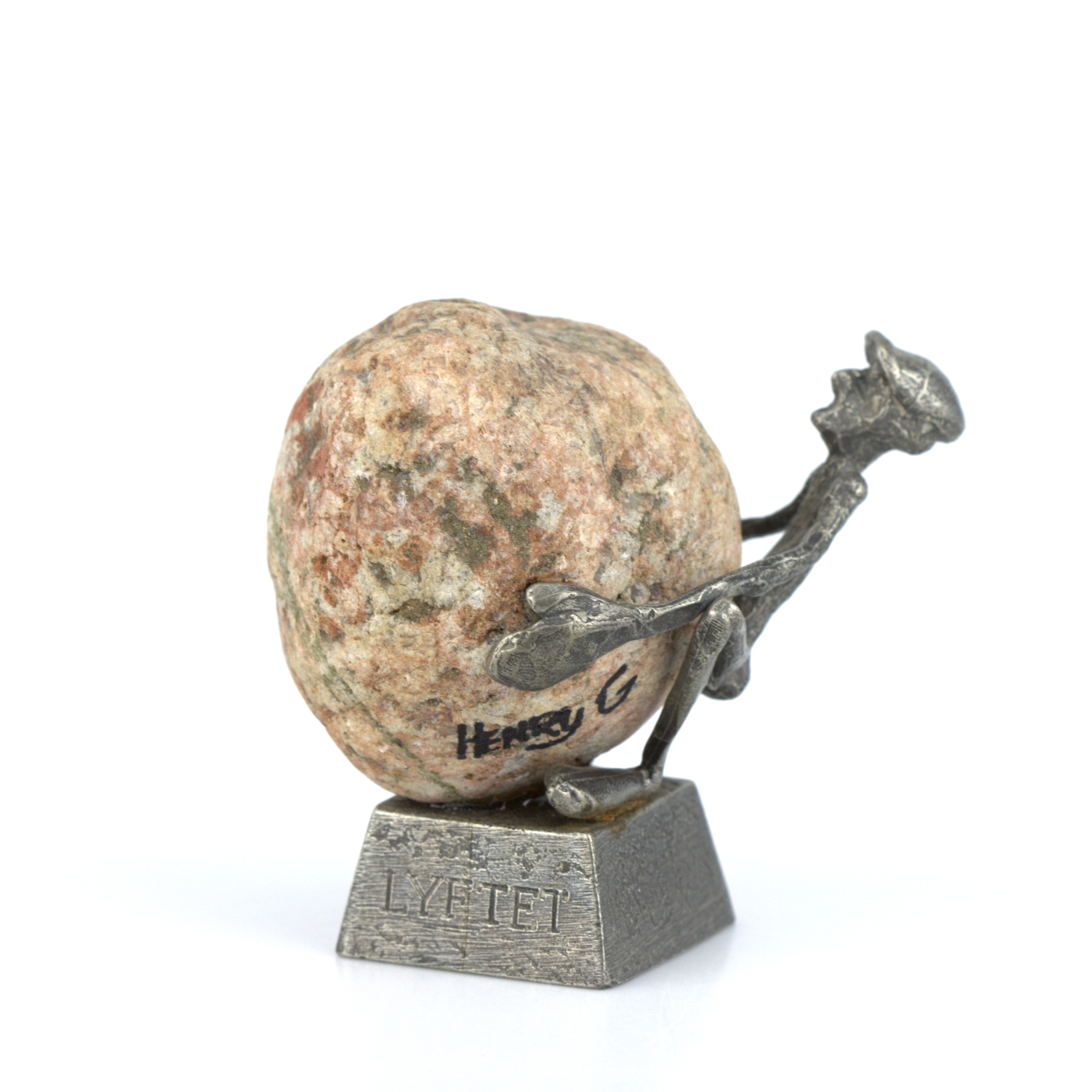 HENRY GUSTAVSSON. Skulptur, "Lyftet", tenn och sten, signerad.