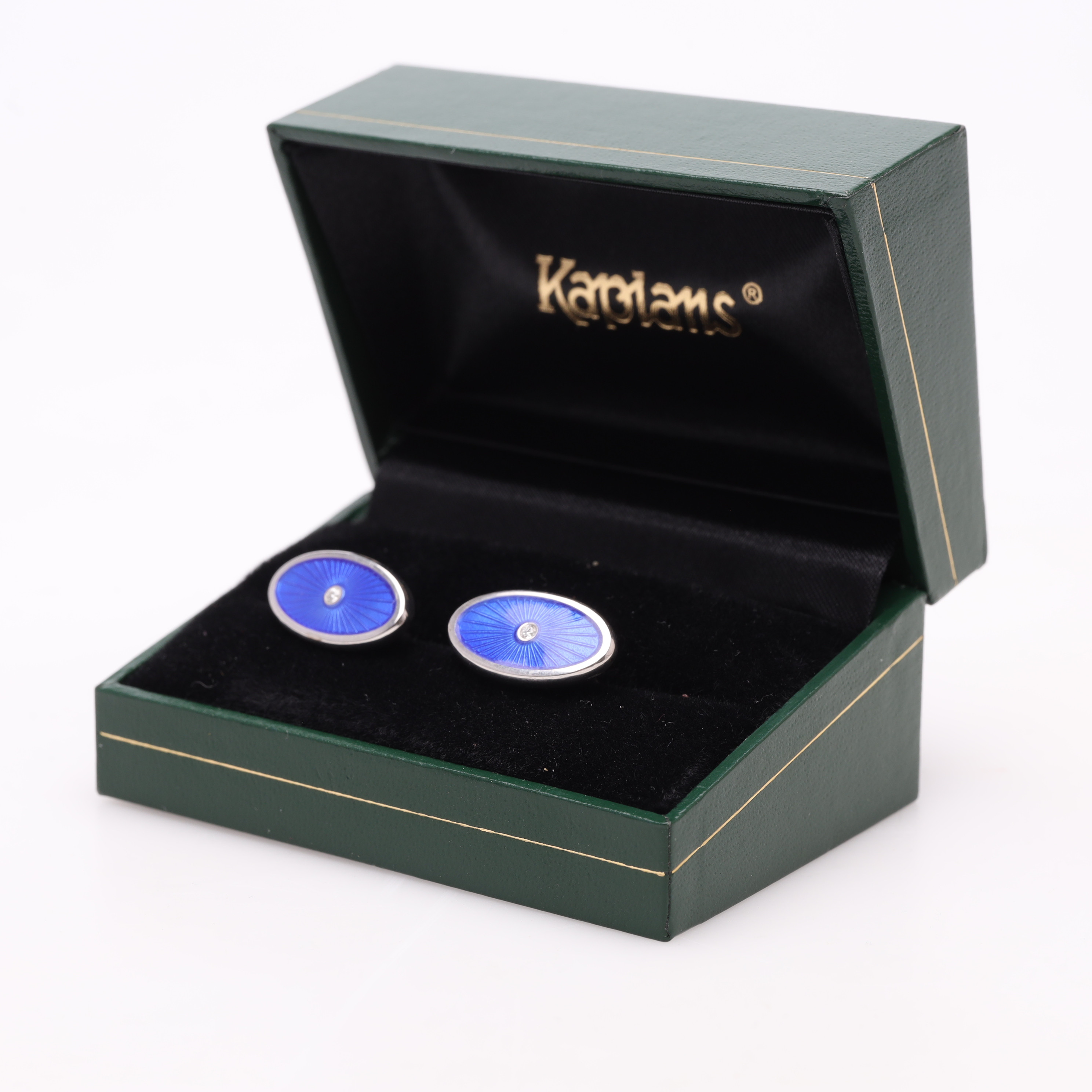MANSCHETTKNAPPAR, ett par, sterlingsilver, emalj, diamant, bruttovikt ca 9,6 gram.