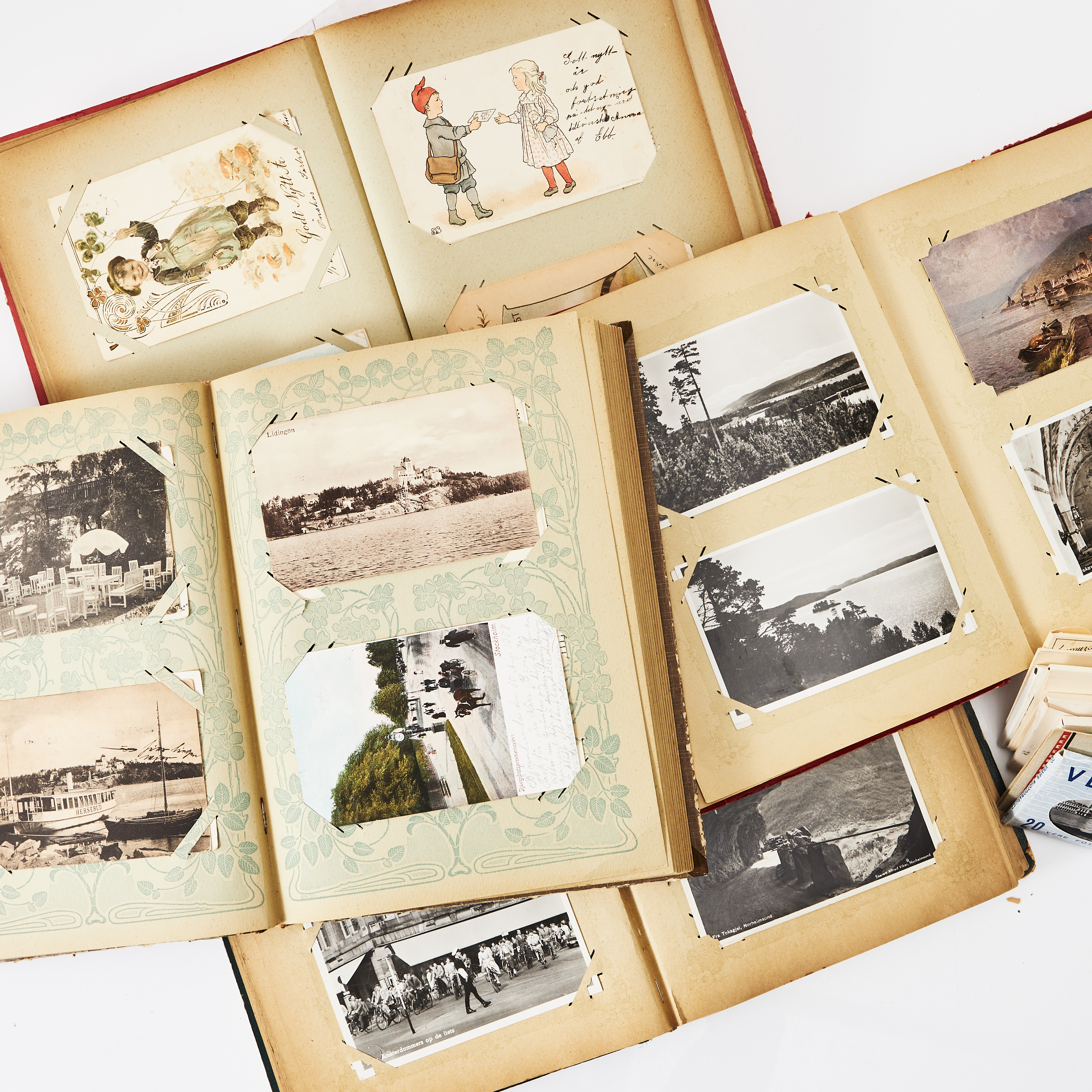 BREVKORT, fyra album, högtidskort, stockholmsbilder samt album från europeiska besöksmål, 1900-talets första hälft, ca 650 kort.