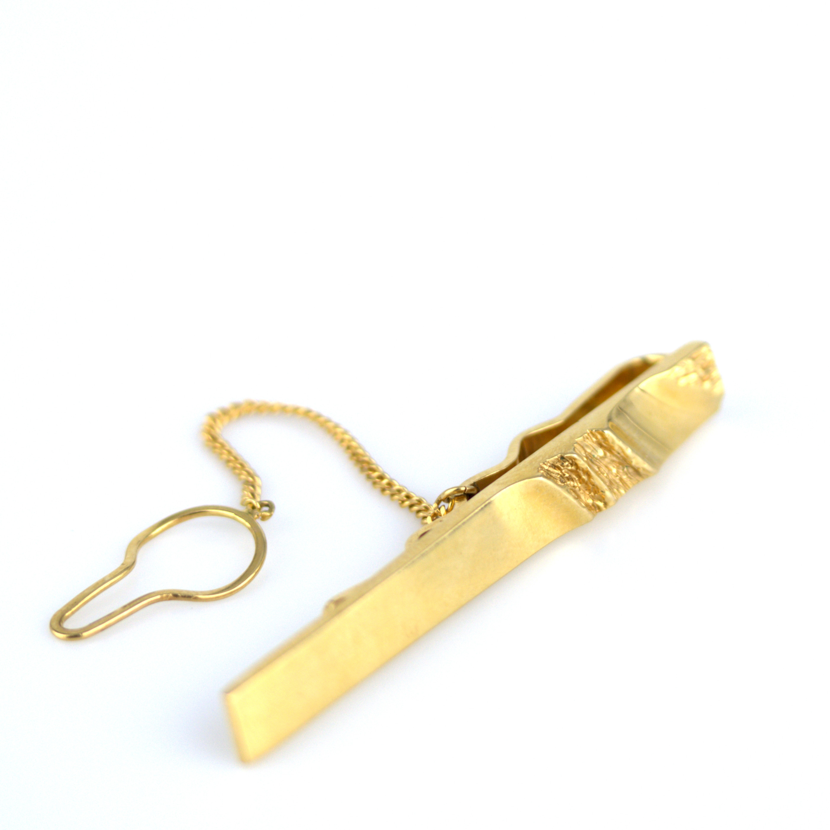 SLIPSKLÄMMA, guld 18k, BEH Bengt Hallberg Guldsmeds AB, Köping 1988.