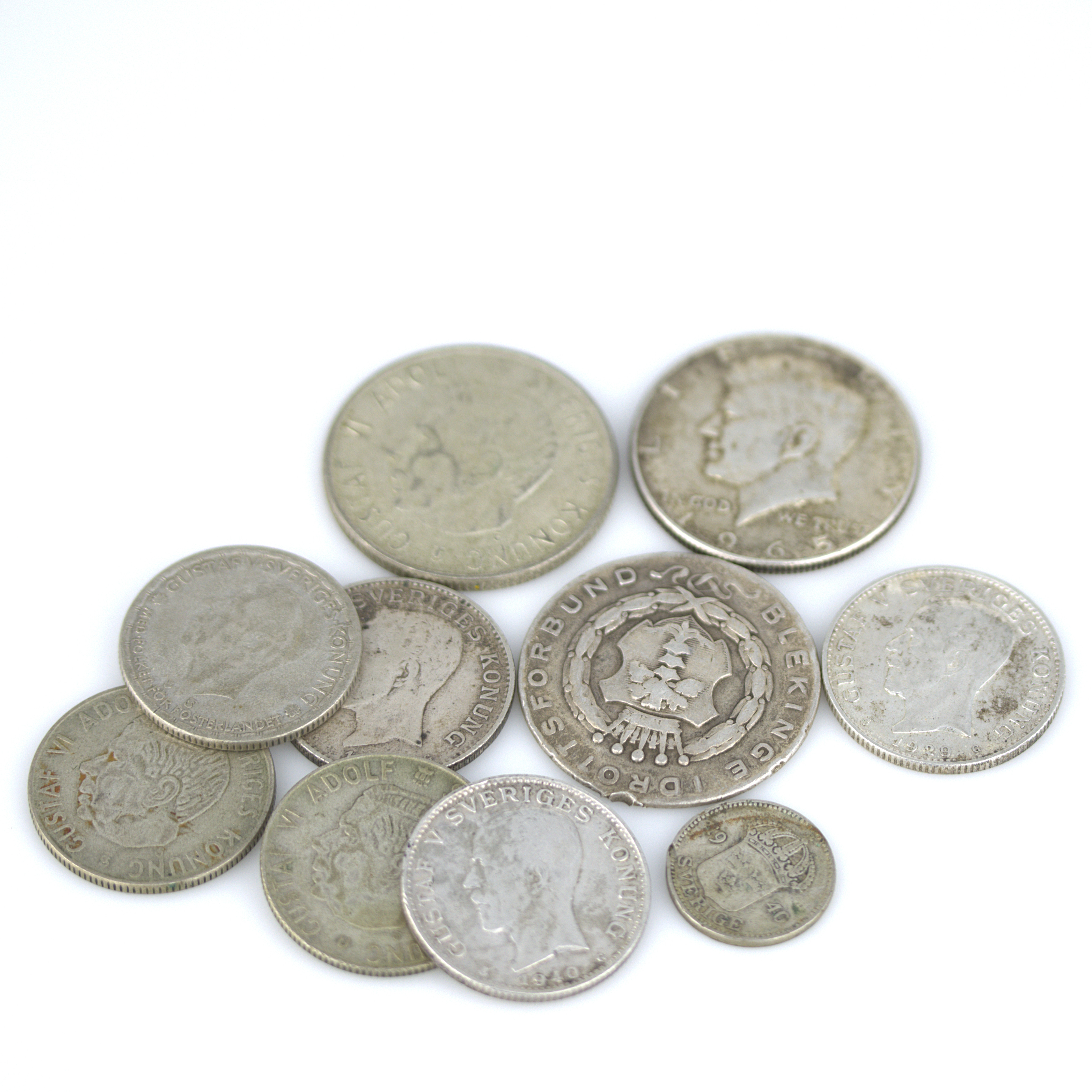 MYNT, svenska cirkulerade, 1900-tal samt en half dollar samt ett idrottspris.