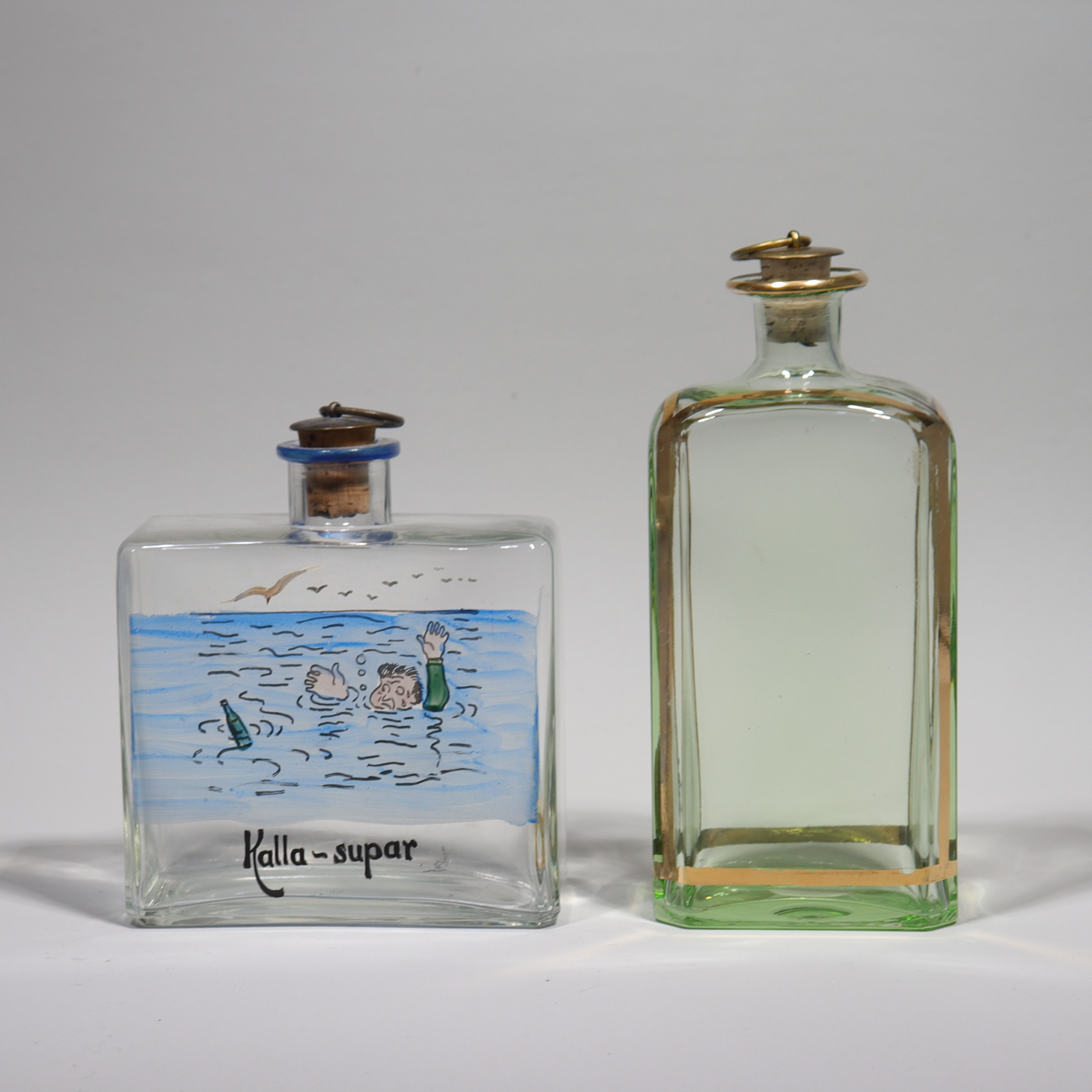TRELLEBORGS GLASBRUK, brännvinsflaskor, 1900-talets första hälft, 2 st.
