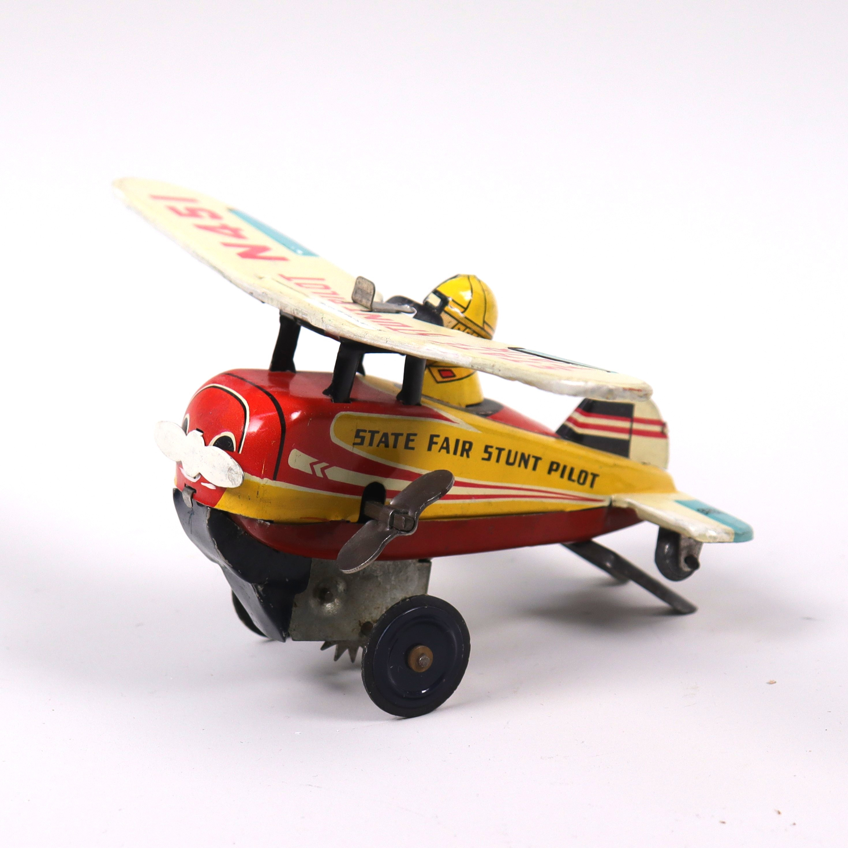 PLÅTLEKSAK, Bandai, Japan, "State Fair Stunt Pilot N451", flygplan med urverk, 1960-tal.