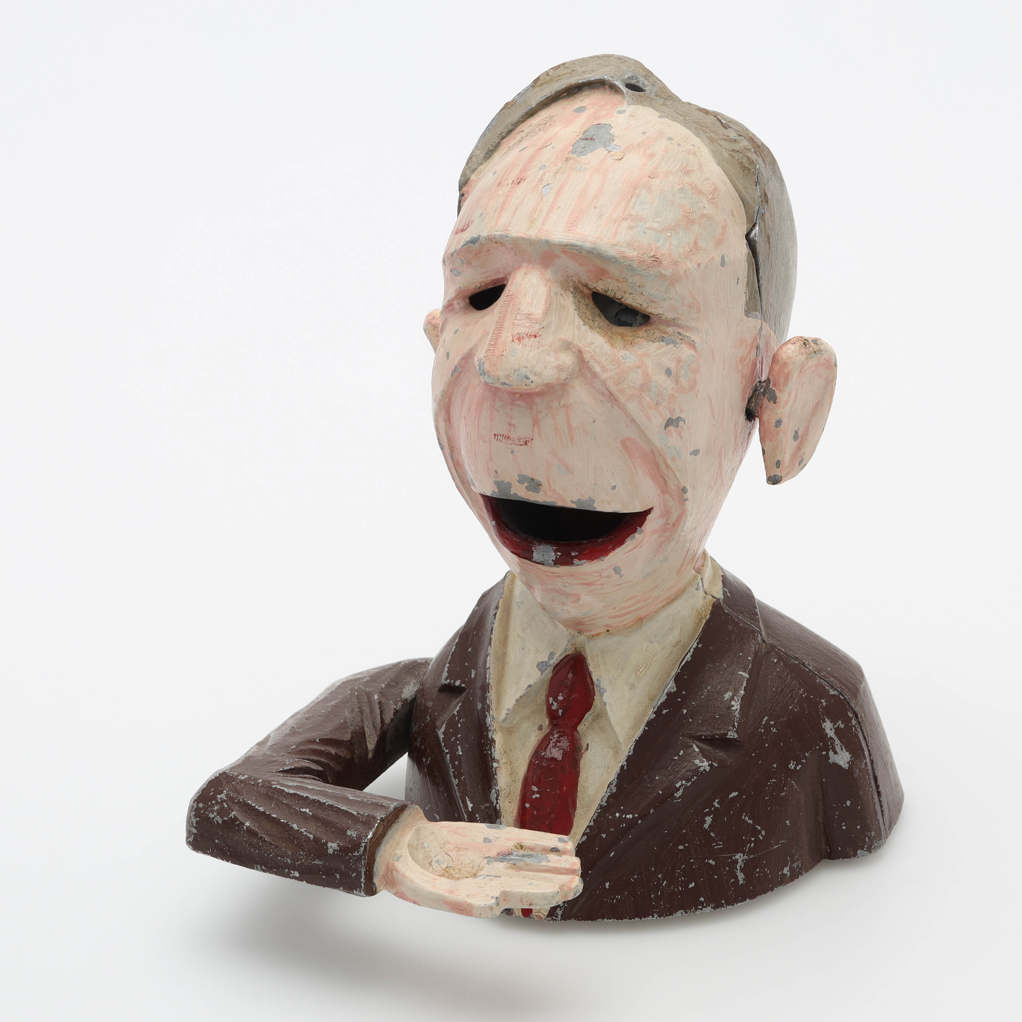 SPARBÖSSA, gjutjärn, handmålad, föreställer finansminister Ernst Wigfoss, 1900-talets mitt.