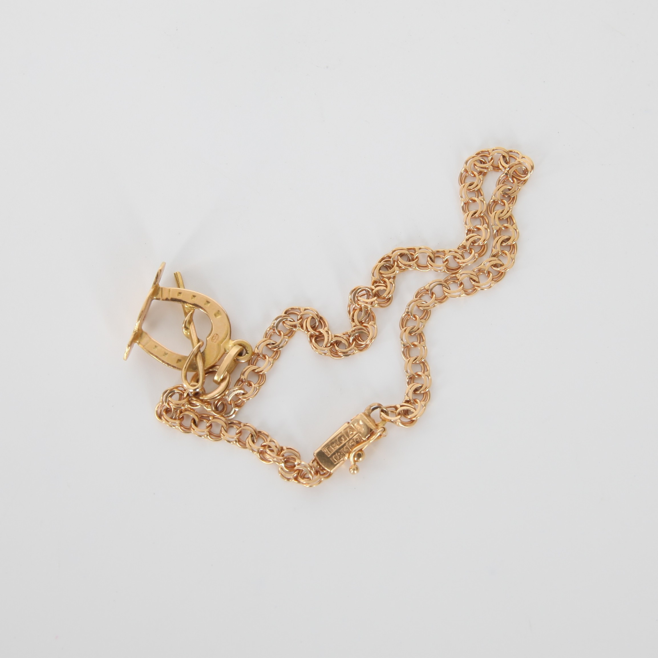 ARMBAND MED BERLOCK, Bismarcklänk, 18K guld, 1968.