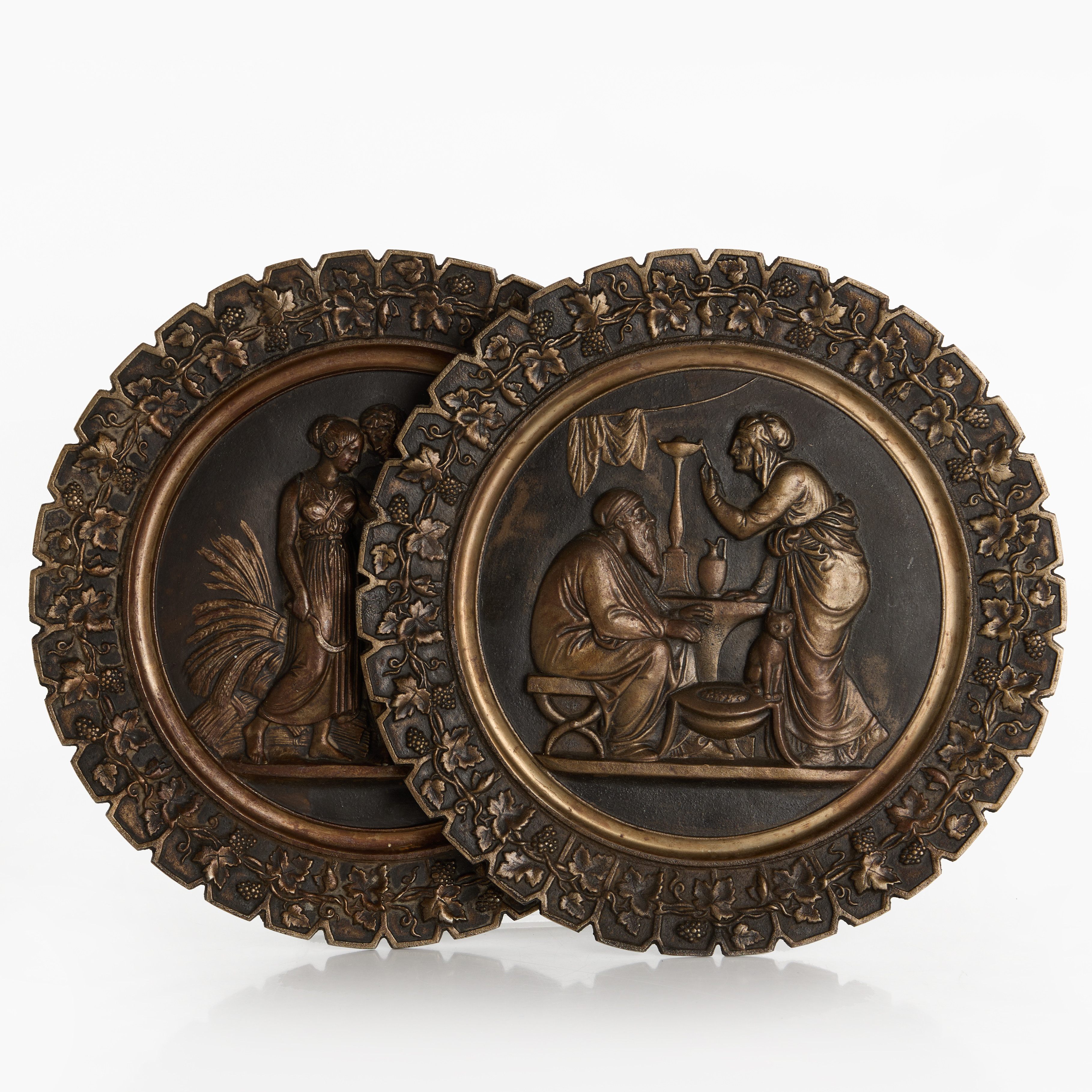 J & C.G. BOLINDER. Väggreliefer, 2 st, bronserat gjiutjärn, Stockholm, 1800-talets senare del, märkta baktill i gjutgods. orientaliserande resp. antikiserande motiv.